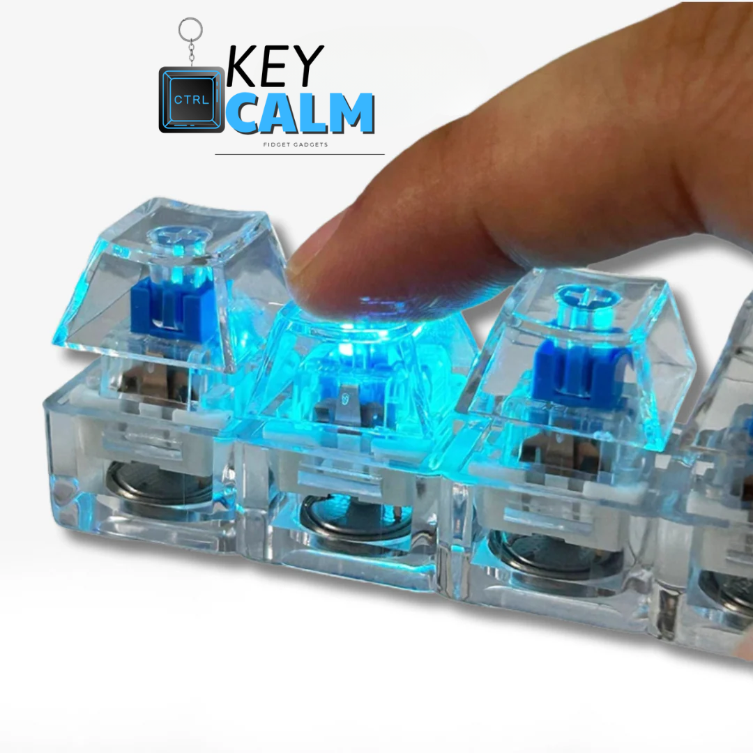 Clear mechanical keyboard switches with blue lighting and a hand pressing one, on a white background.